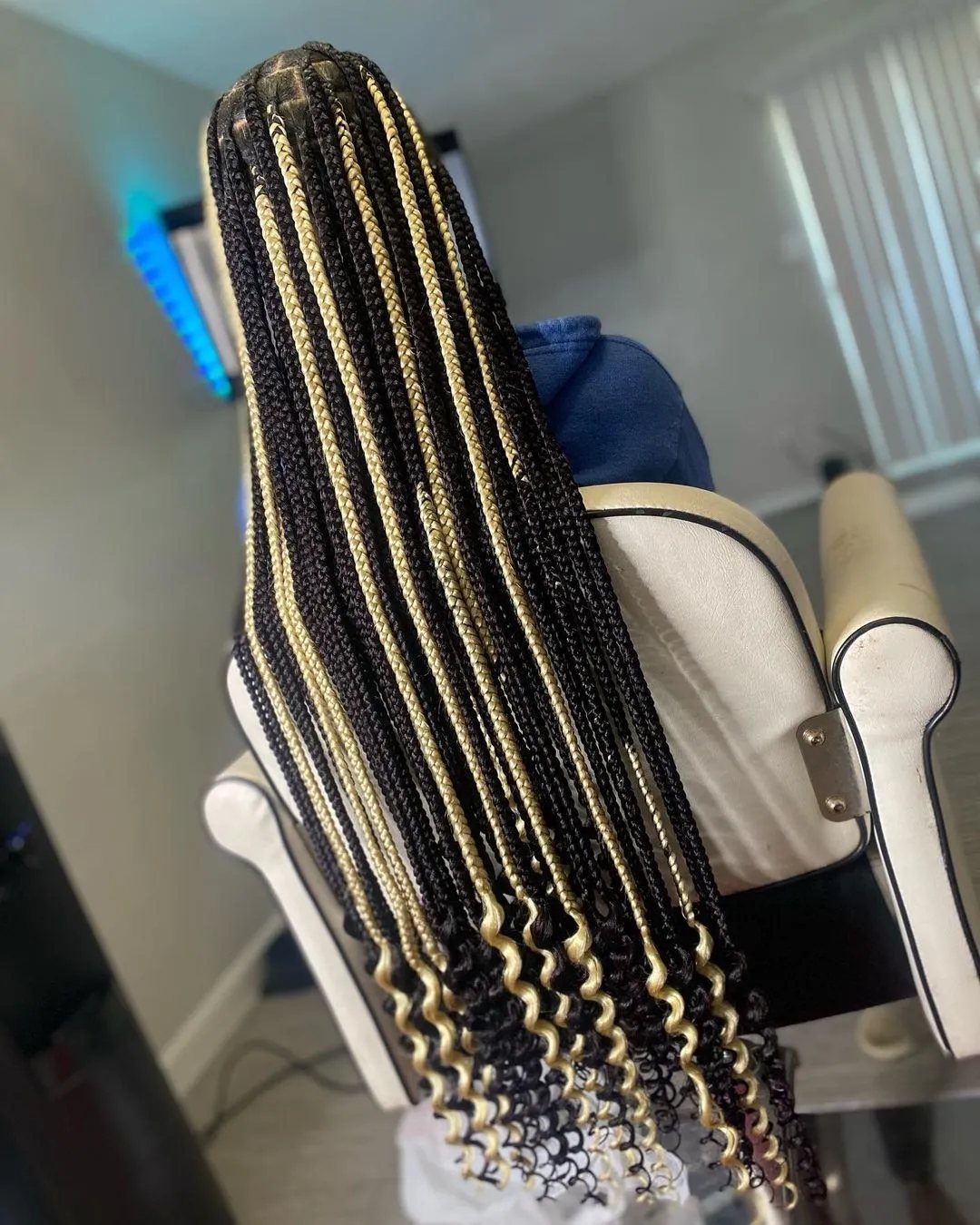 12 Braids Hairstyles: 29 Ideas, From Box Braids to Milkmaid 10 Long black and blonde knotless braids with curly ends on a person.