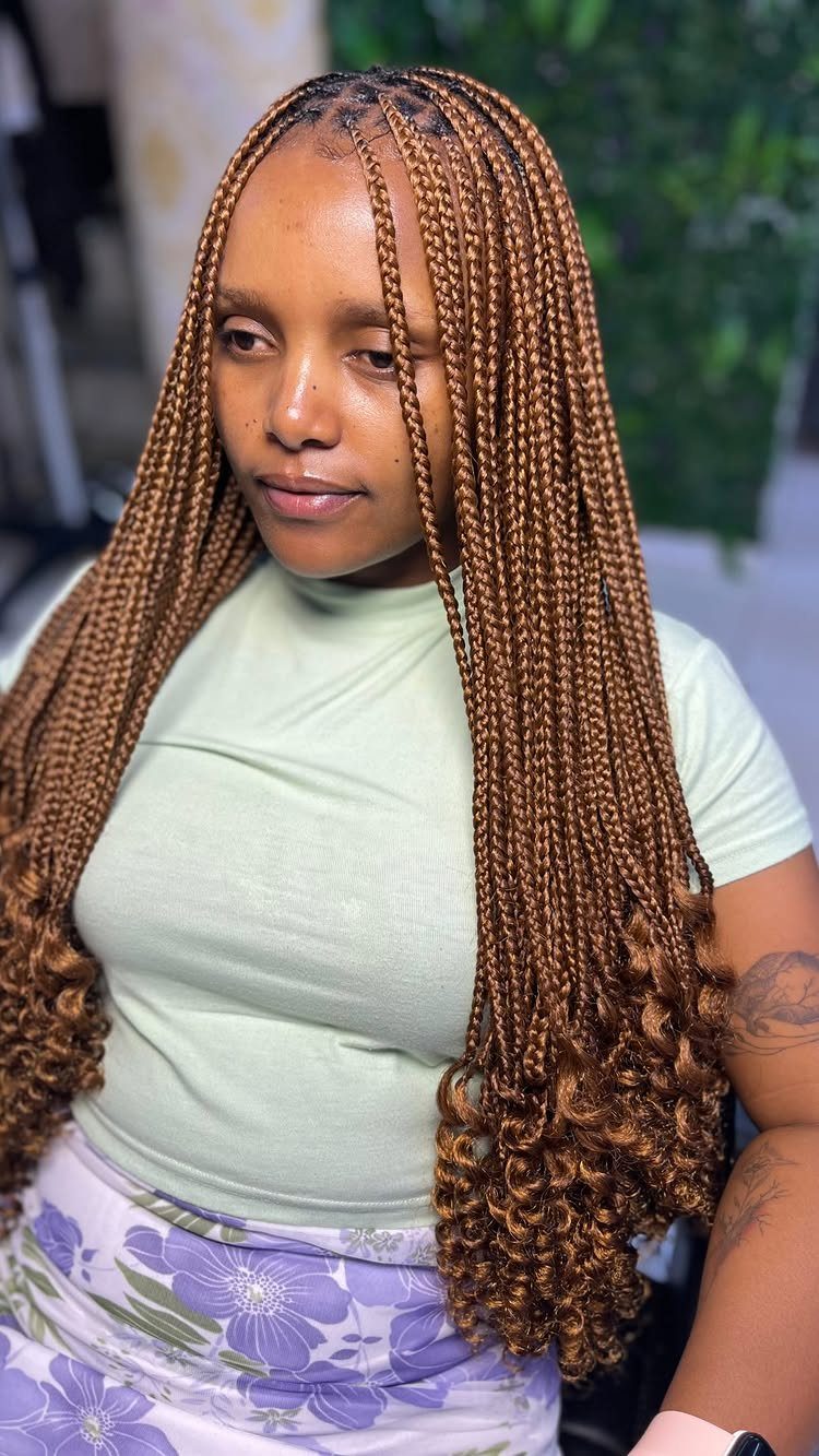 12 Braids Hairstyles: 29 Ideas, From Box Braids to Milkmaid 23 Woman with long light brown box braids ending in voluminous curly tips.
