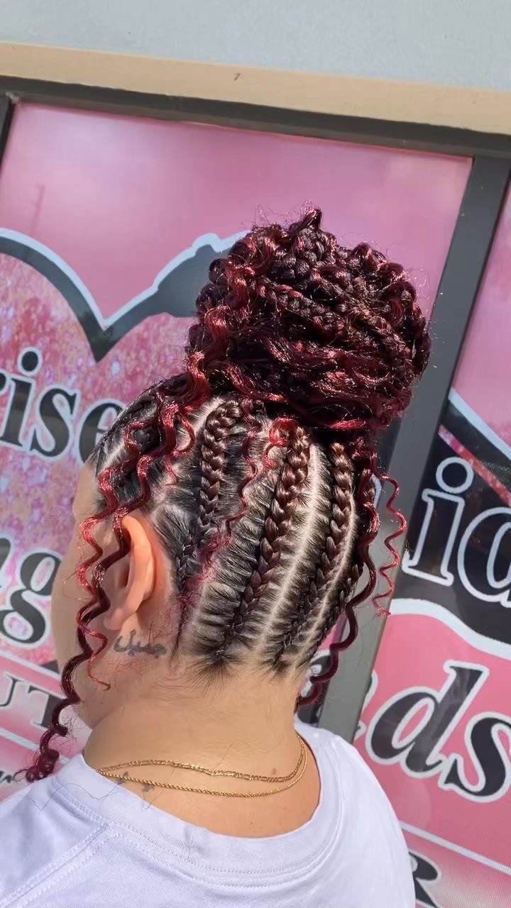 12 Braids Hairstyles: 29 Ideas, From Box Braids to Milkmaid 20 Person with red and black cornrows gathered into a large braided bun.