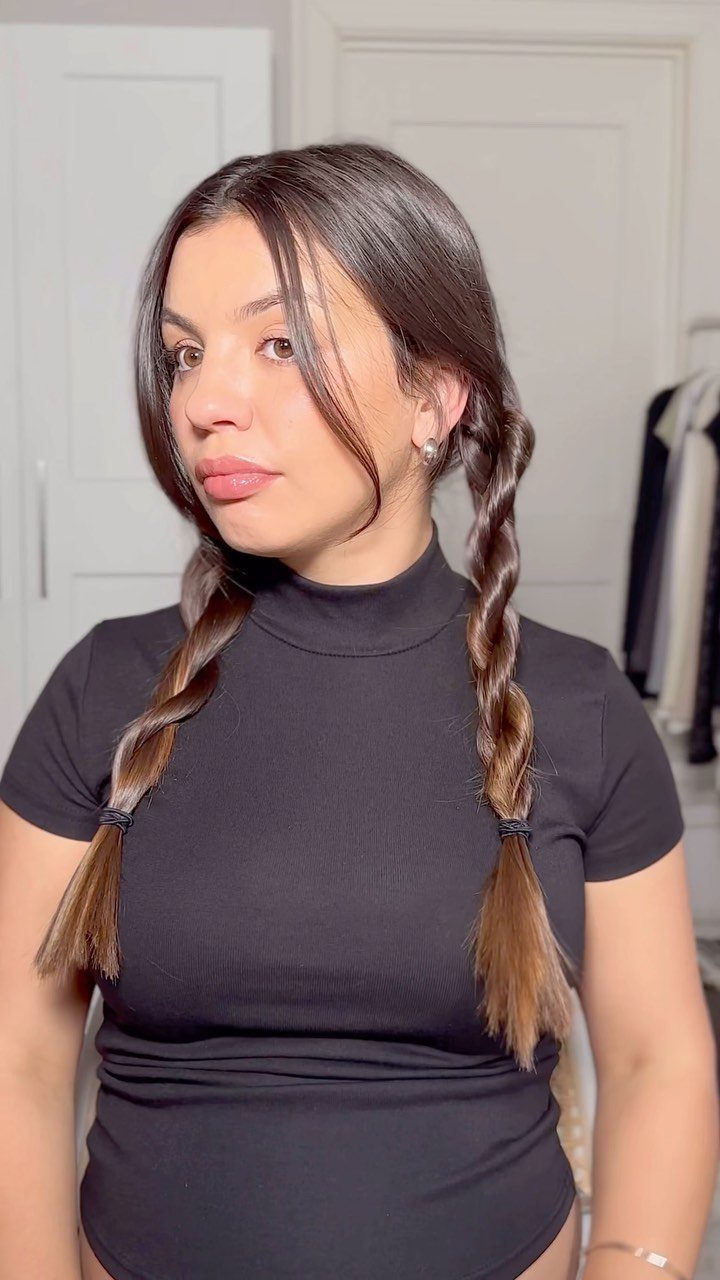 12 Braids Hairstyles: 29 Ideas, From Box Braids to Milkmaid 18 Woman with brown hair styled in two rope braids over her shoulders.