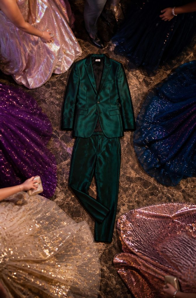 A sharply cut suit paired with an embellished top for prom.