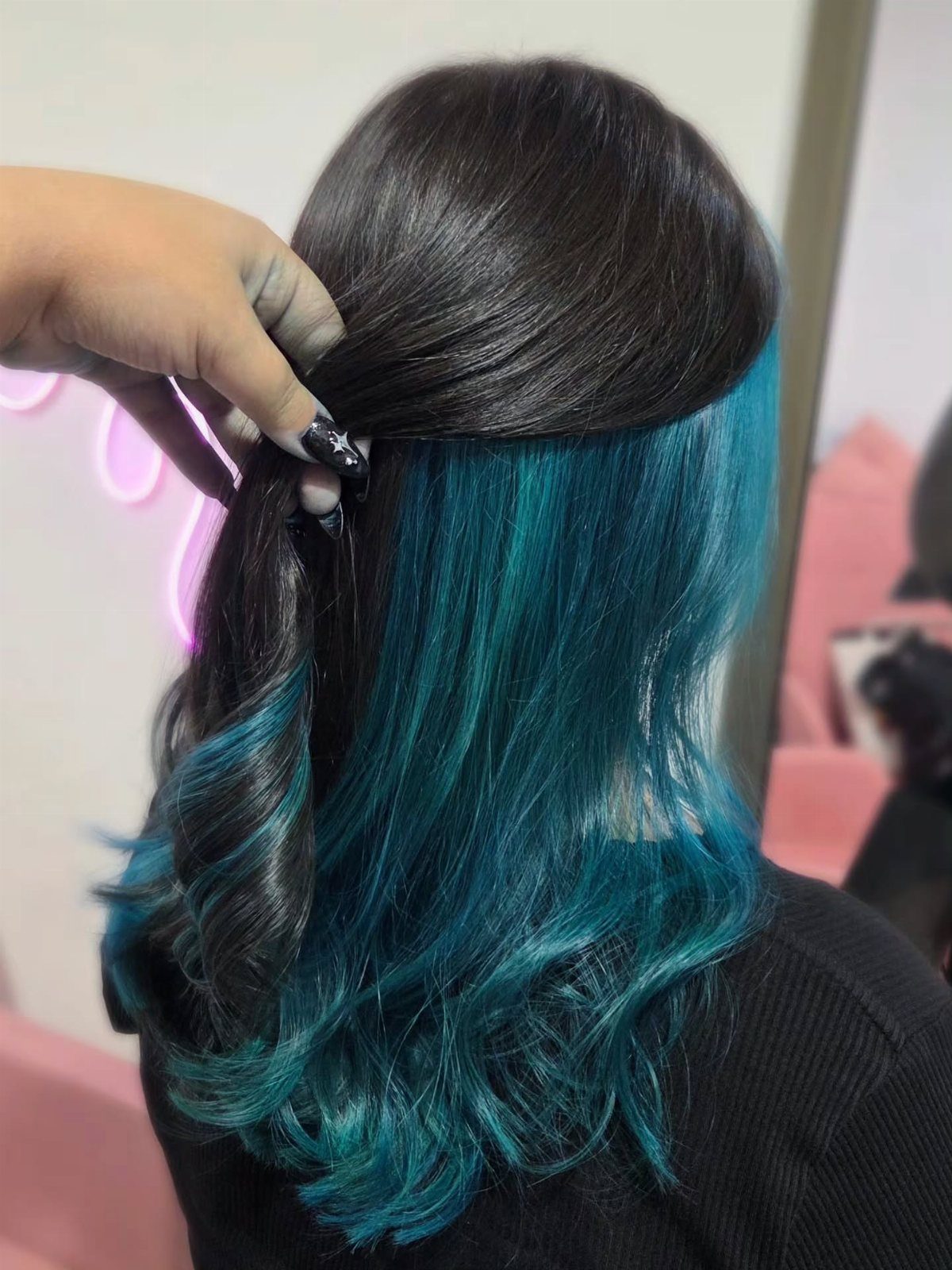 8 Blue Highlights for Brown Hair Ideas and Styles 5 Dark brown hair with vibrant teal blue highlights styled in soft waves