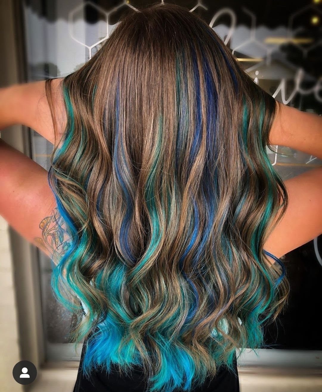 8 Blue Highlights for Brown Hair Ideas and Styles 2 Wavy brown hair with vibrant turquoise and royal blue highlights from the back