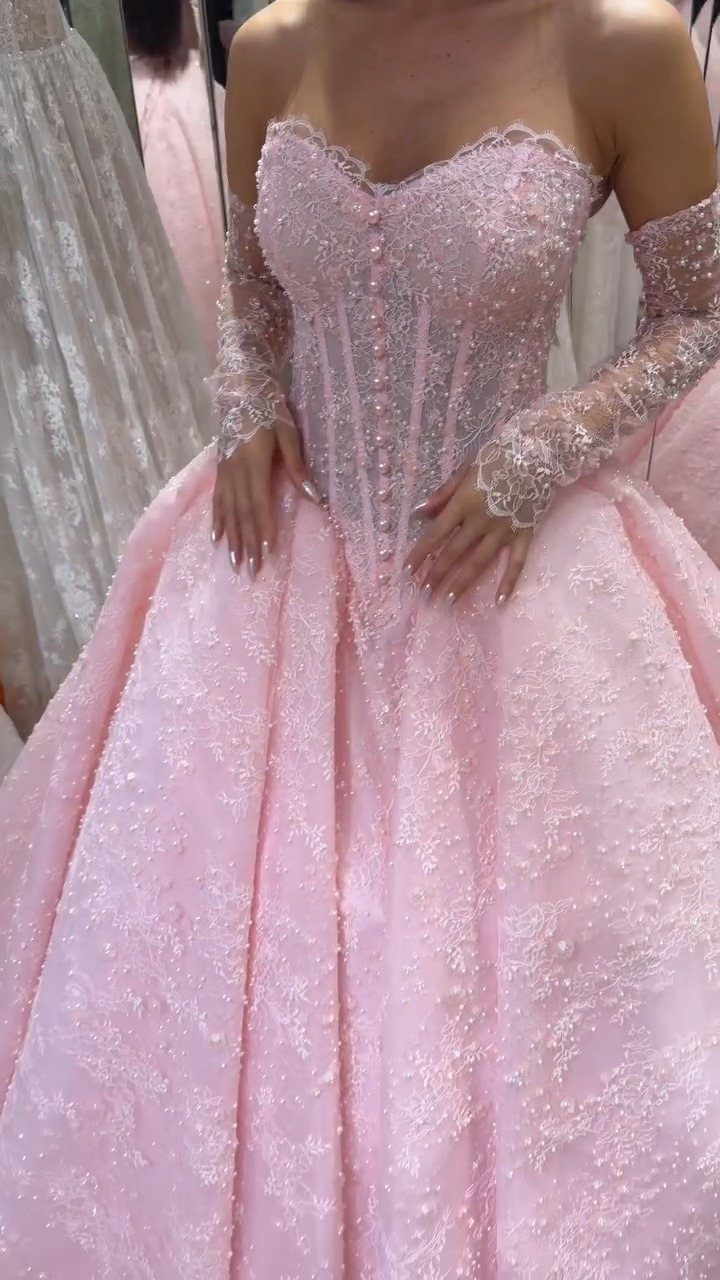 25 Blush Wedding Dress Ideas in Lace, Tulle, Silk and Sequins 24 Blush pink wedding dress with a beaded corset and full embroidered skirt.