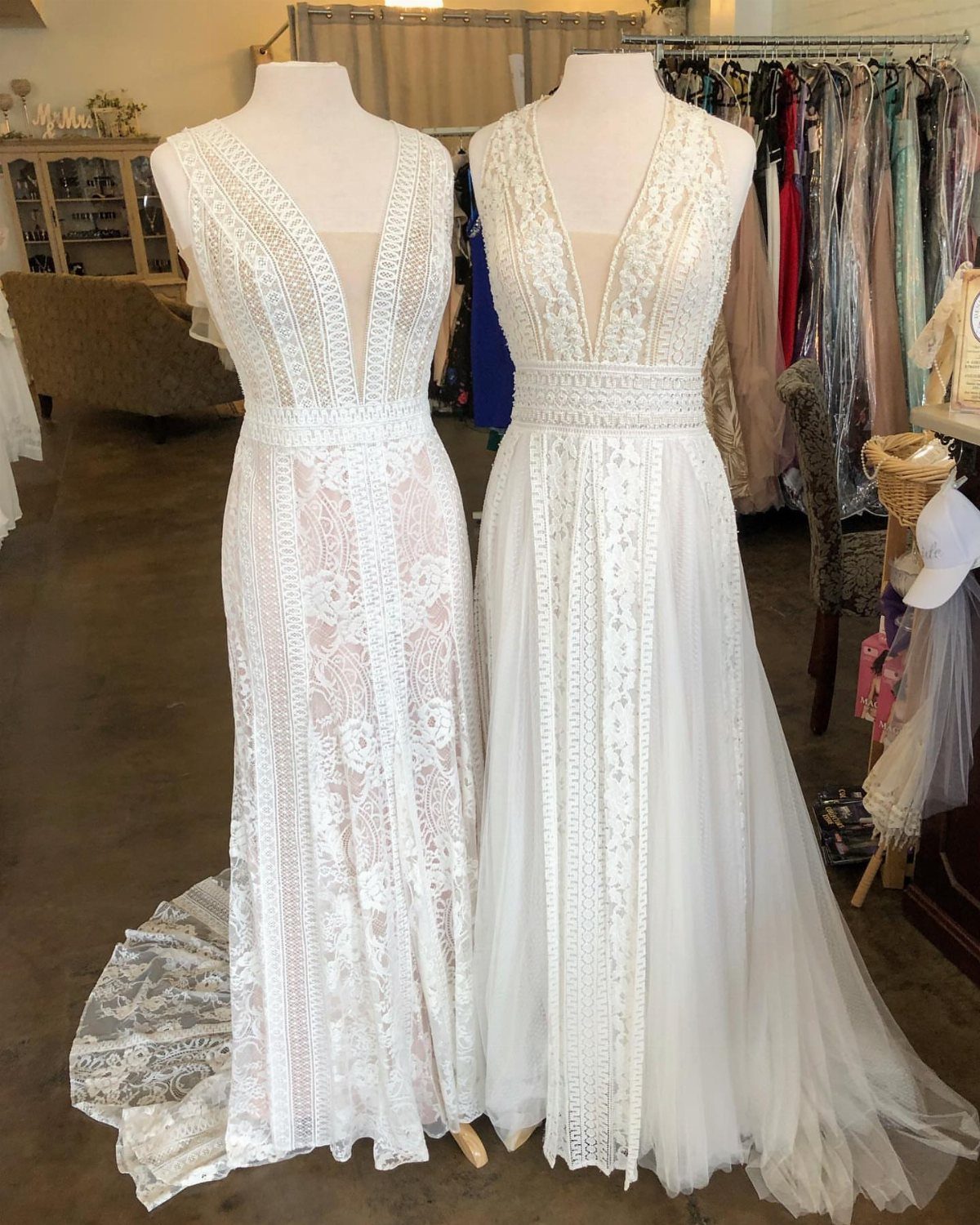25 Blush Wedding Dress Ideas in Lace, Tulle, Silk and Sequins 10 Two white lace wedding dresses on mannequins, one featuring a blush lace lining.