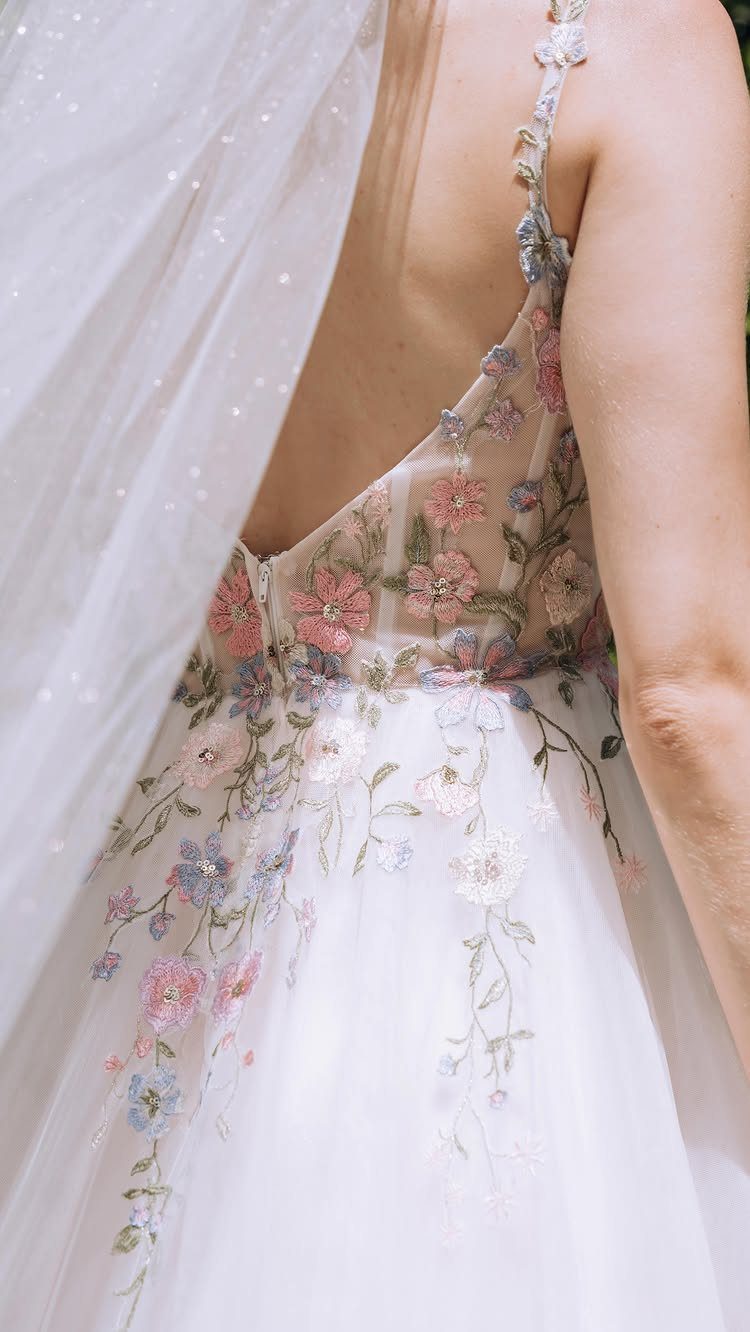 25 Blush Wedding Dress Ideas in Lace, Tulle, Silk and Sequins 3 Pink wedding gown with colorful floral embroidery and a sheer white bridal veil.