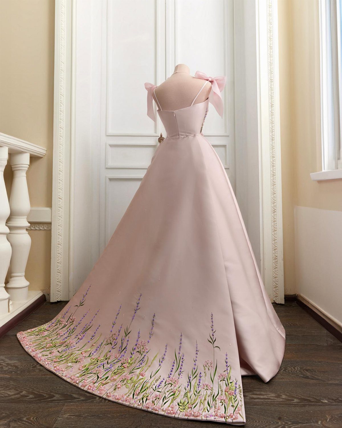 25 Blush Wedding Dress Ideas in Lace, Tulle, Silk and Sequins 12 Pale pink satin gown with hand-painted purple floral details on the train.