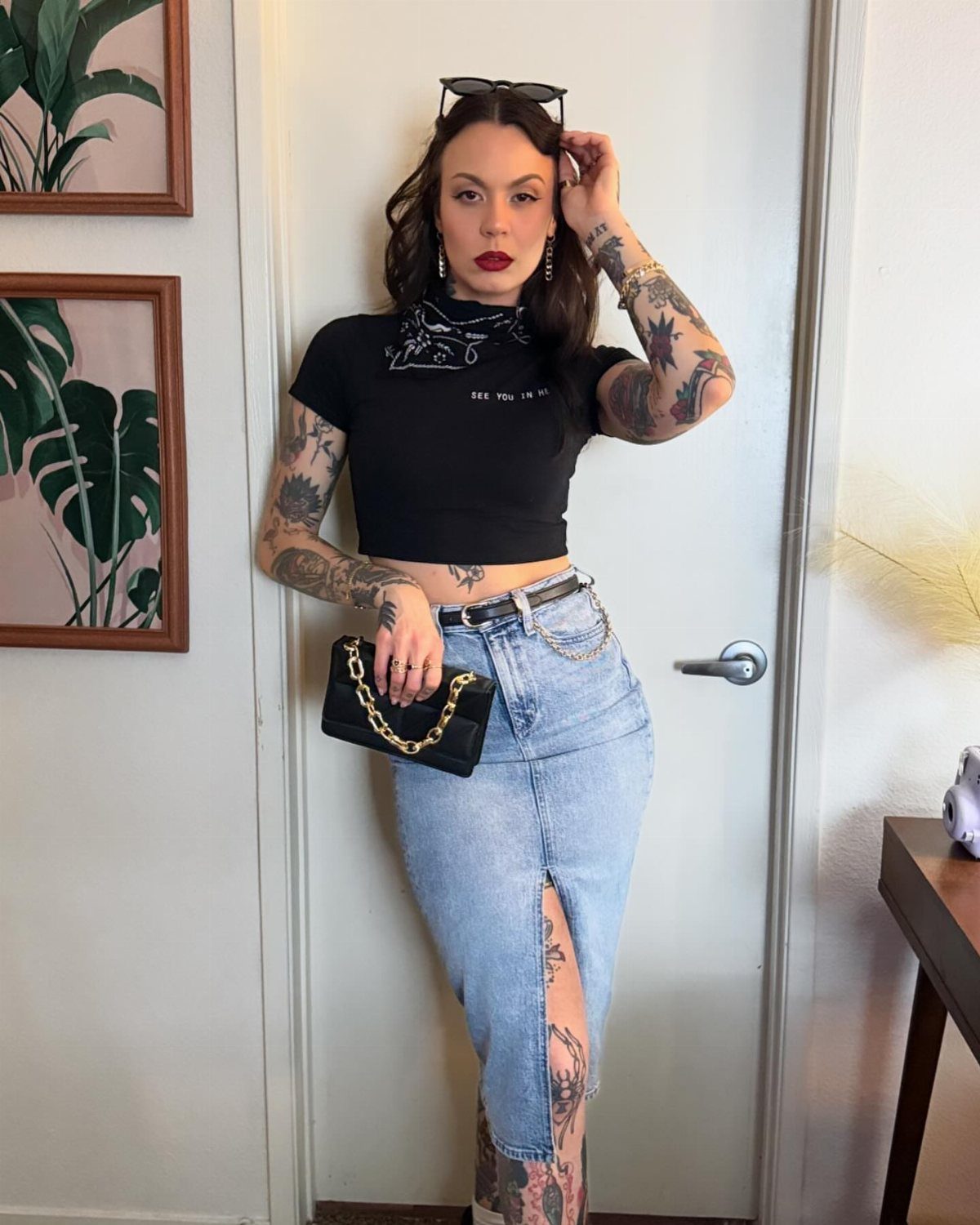 Casual Outfits for Las Vegas: 35 Ideas for Day and Night 11 Woman wearing a black crop top and long denim skirt with a front slit.