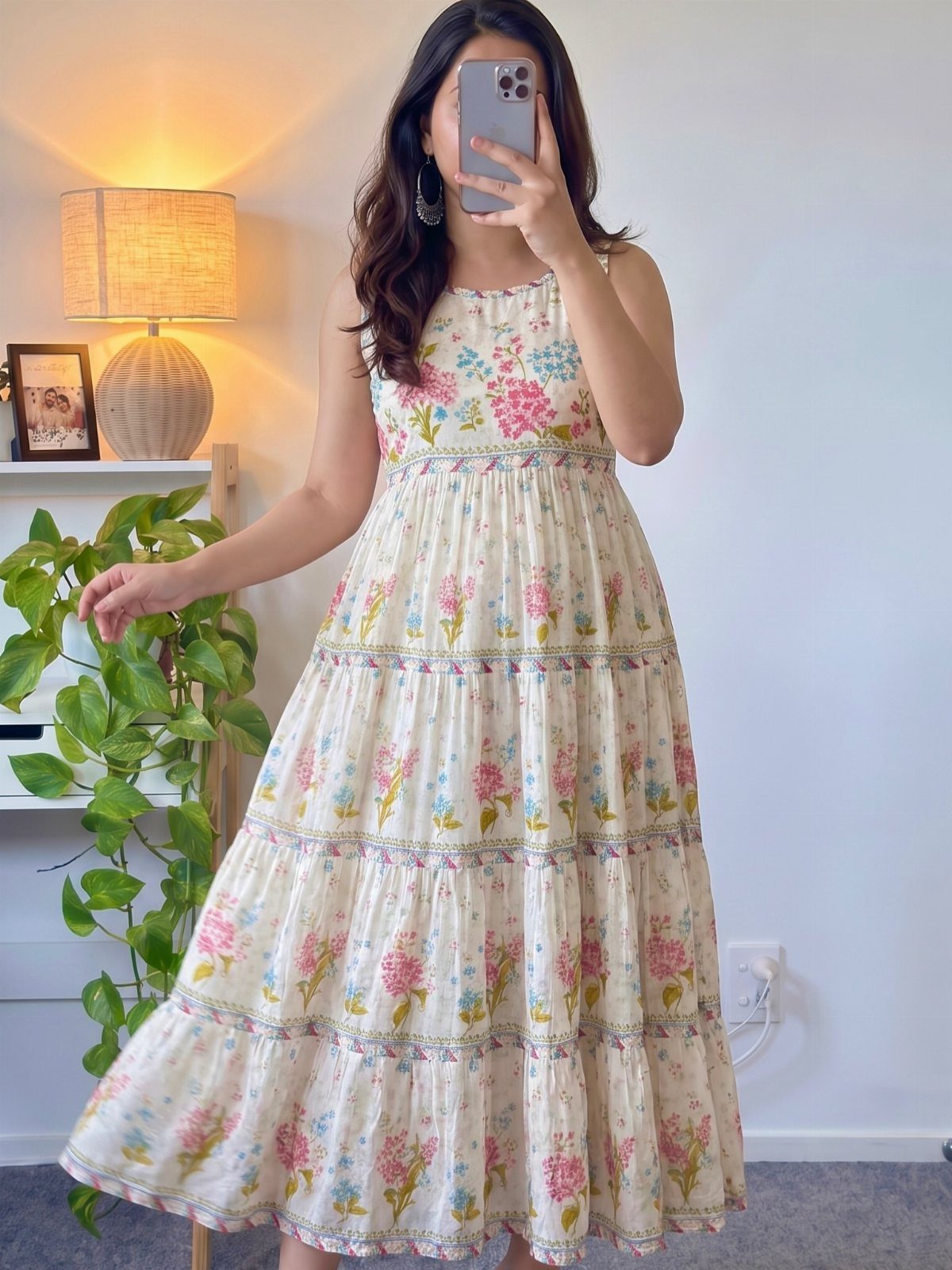 Casual Outfits for Las Vegas: 35 Ideas for Day and Night 33 Woman wearing a white tiered midi dress with a pink and blue floral print.