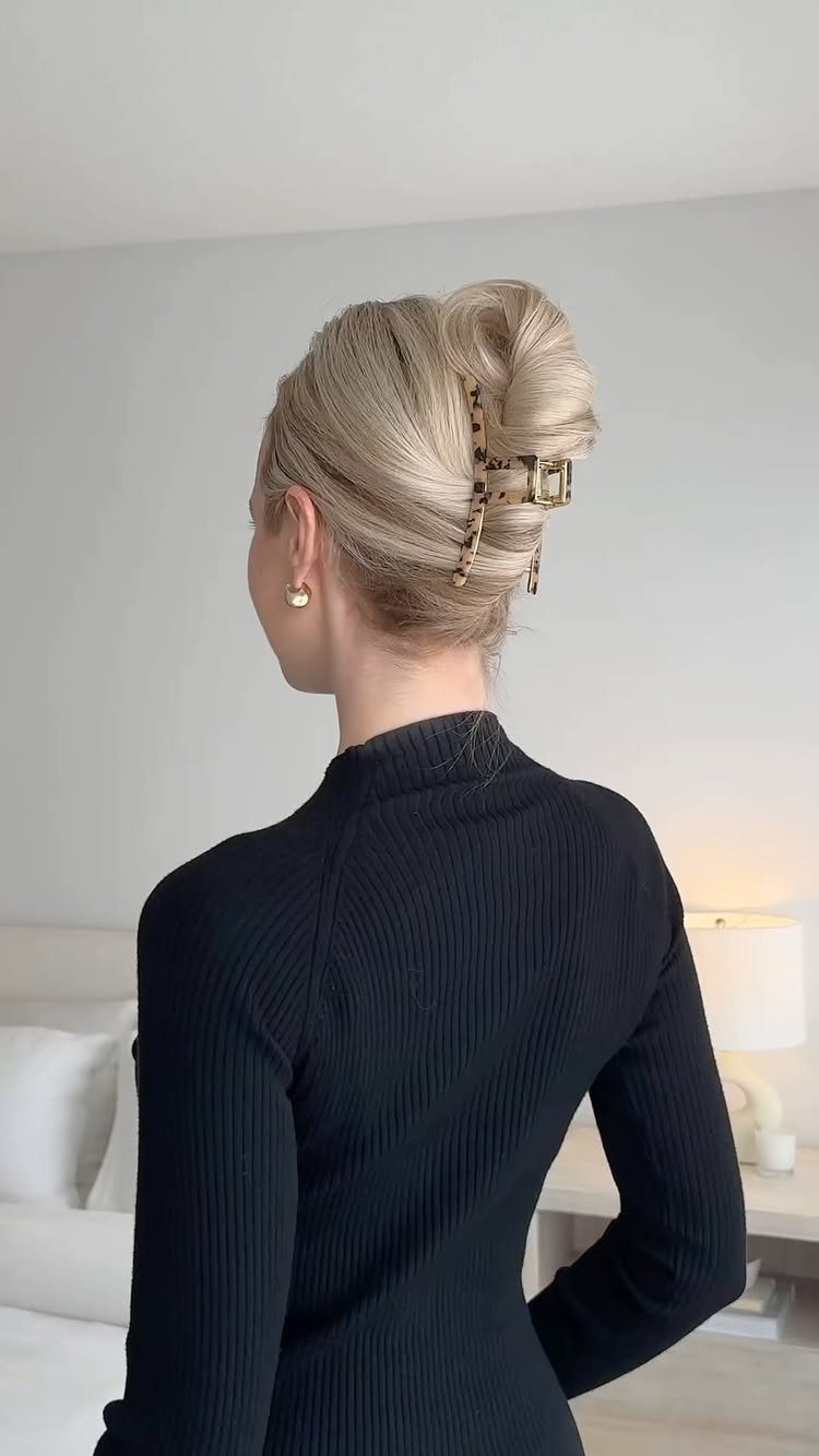 11 Clip Up Hairstyles From French Twists to Half-Up Buns 2 Blonde hair styled in a French twist secured with a tortoiseshell claw clip.