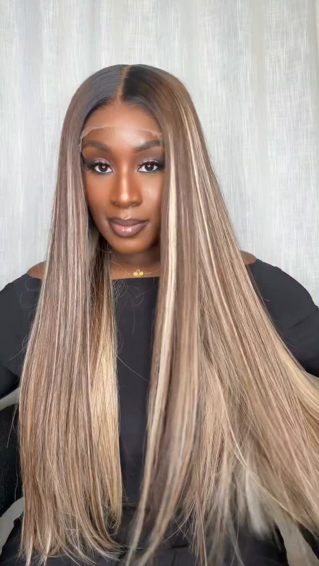 Dark Winter Hair Color: 9 Shades From Black to Burgundy 2 Woman with long straight hair featuring dark brown roots and ash blonde highlights.