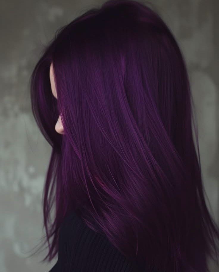 Dark Winter Hair Color: 9 Shades From Black to Burgundy 10 Long straight deep purple hair on a person against a grey wall