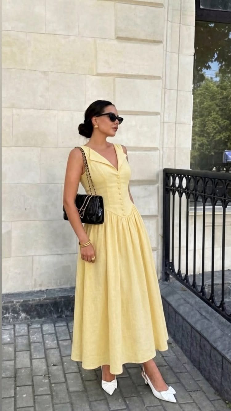 Formal Casual Dresses: 20 Ideas From Shirt Dresses to Velvet 4 Woman in a pale yellow sleeveless midi dress with white heels and black sunglasses.