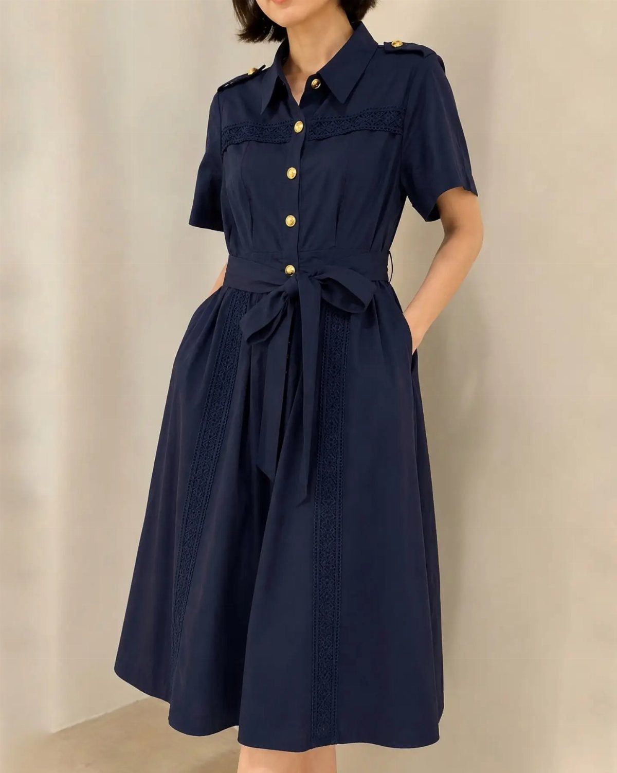 Formal Casual Dresses: 20 Ideas From Shirt Dresses to Velvet 5 Navy blue midi shirtdress with gold buttons and lace trim detailing on a person.
