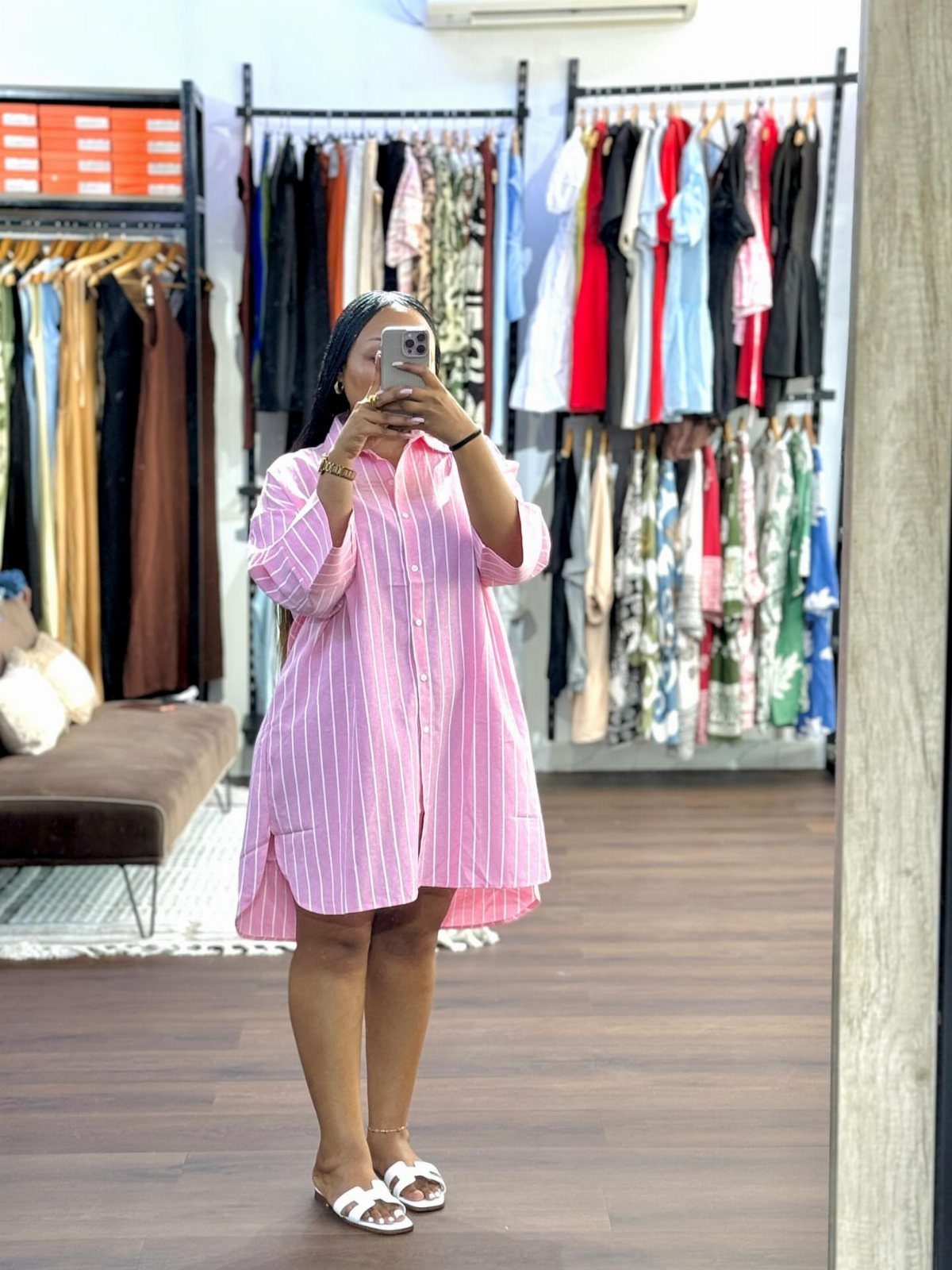 Formal Casual Dresses: 20 Ideas From Shirt Dresses to Velvet 2 Woman in a pink and white striped shirt dress posing in a clothing store.
