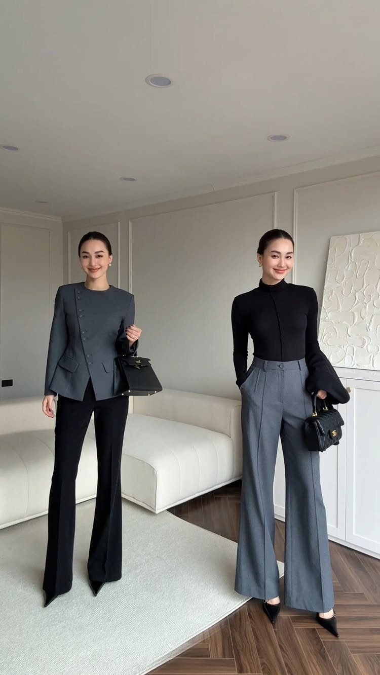 10 Grey Dress Pants Outfit Ideas for Work and Weekends 11 Two women posing in modern outfits featuring grey blazers and grey wide-leg trousers.