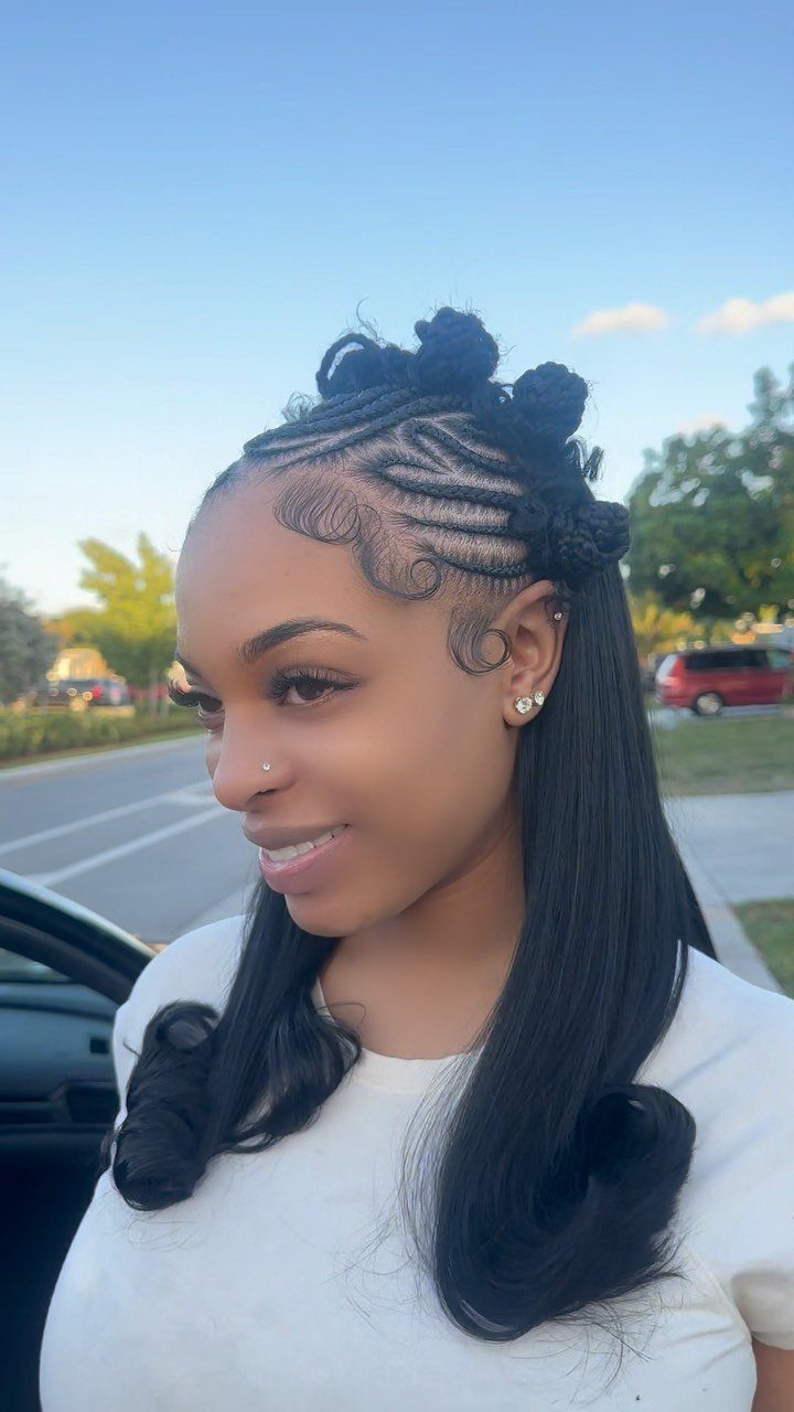 Woman with black hair styled in feed-in braids and long straight hair.