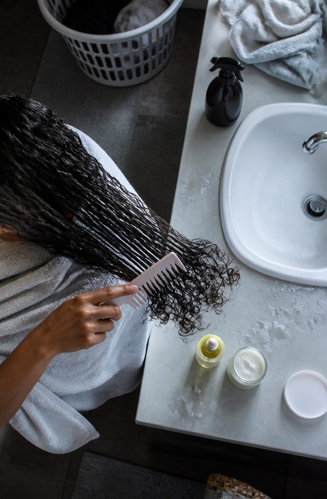 How to Get Curly Hair in 5 Steps, Matched to Your Hair Type 8 Model with defined curls in a photograph about moisture and frizz
