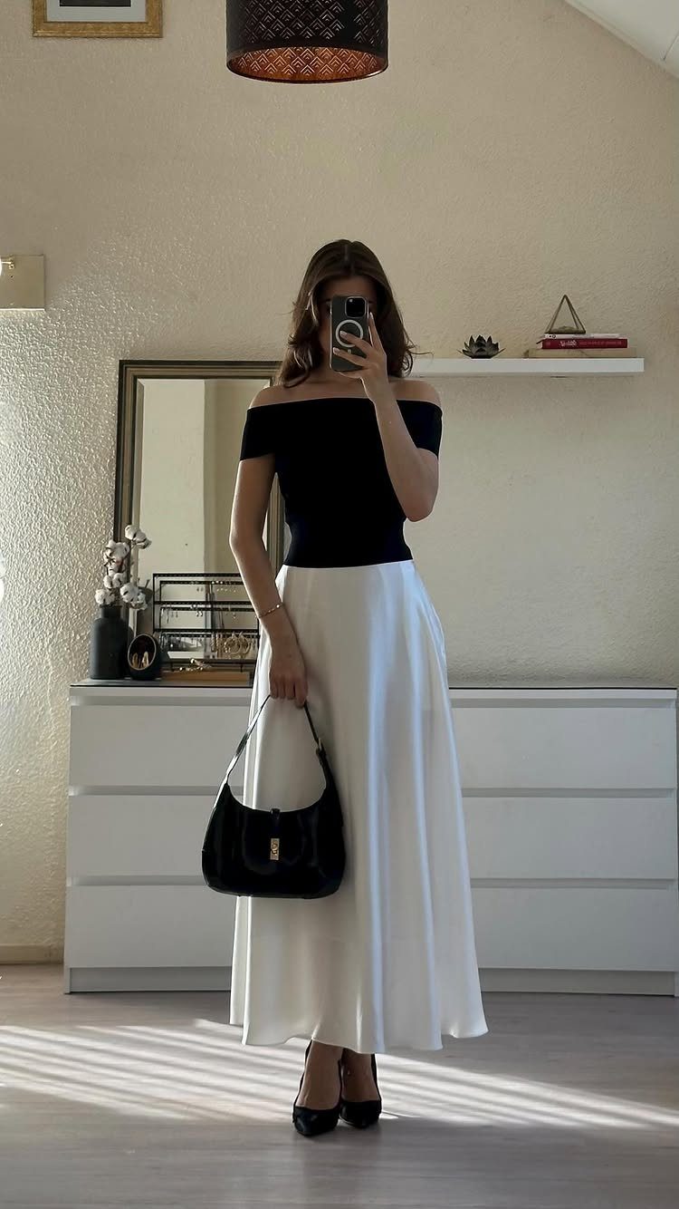 Semi Casual Clothes: 31 Outfit Ideas From Dresses to Loafers 25 Woman wearing a black off-the-shoulder top and long white satin skirt with black heels.