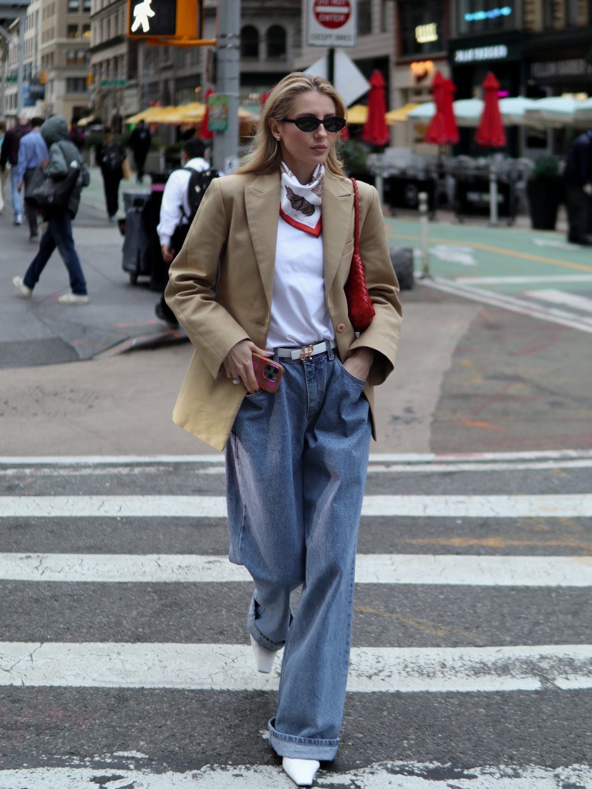 Semi Casual Clothes: 31 Outfit Ideas From Dresses to Loafers 19 Woman in tan blazer and wide-leg jeans walking across a city street crosswalk.