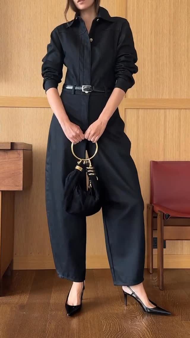 Semi Casual Clothes: 31 Outfit Ideas From Dresses to Loafers 21 Person in a black collared jumpsuit with a belt and black high heels.