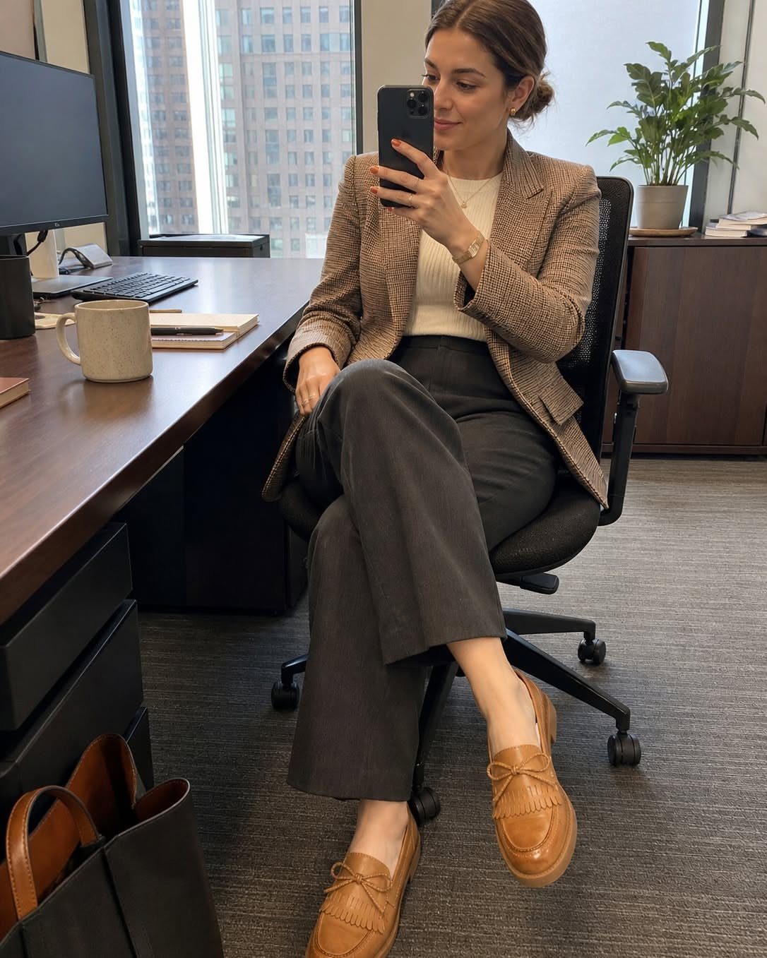 Women Outfit Work Office: 17 Ideas to Refresh Your Look 10 Woman in a brown blazer and grey trousers posing in an office setting.