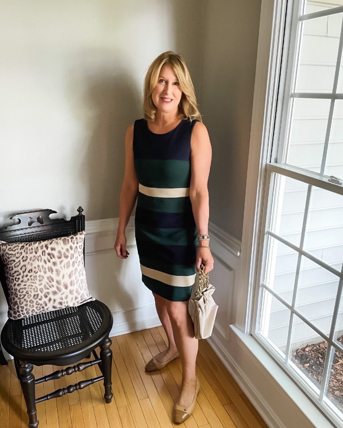 Women Outfit Work Office: 17 Ideas to Refresh Your Look 2 Woman in a striped sheath dress and tan flats standing in a room.